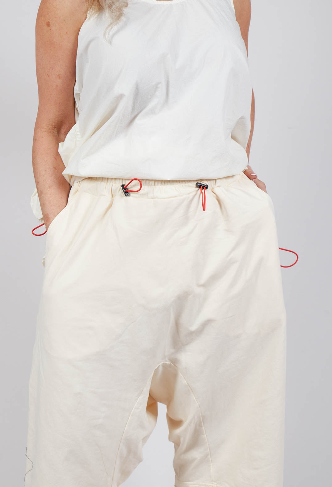 Cropped Drop-Crotch Trousers in Greige