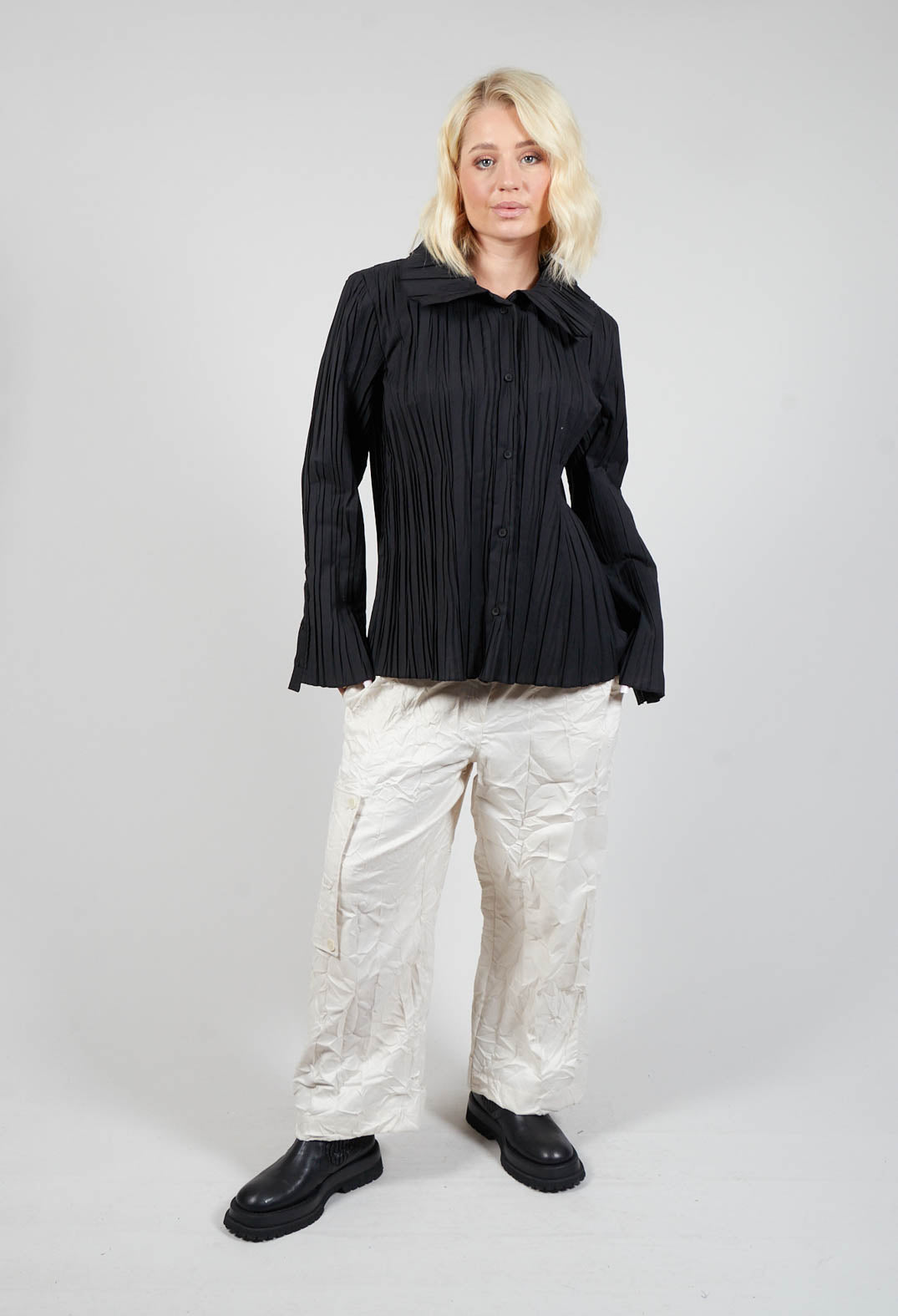 long shot of lady wearing a black dalia blouse with long sleeves