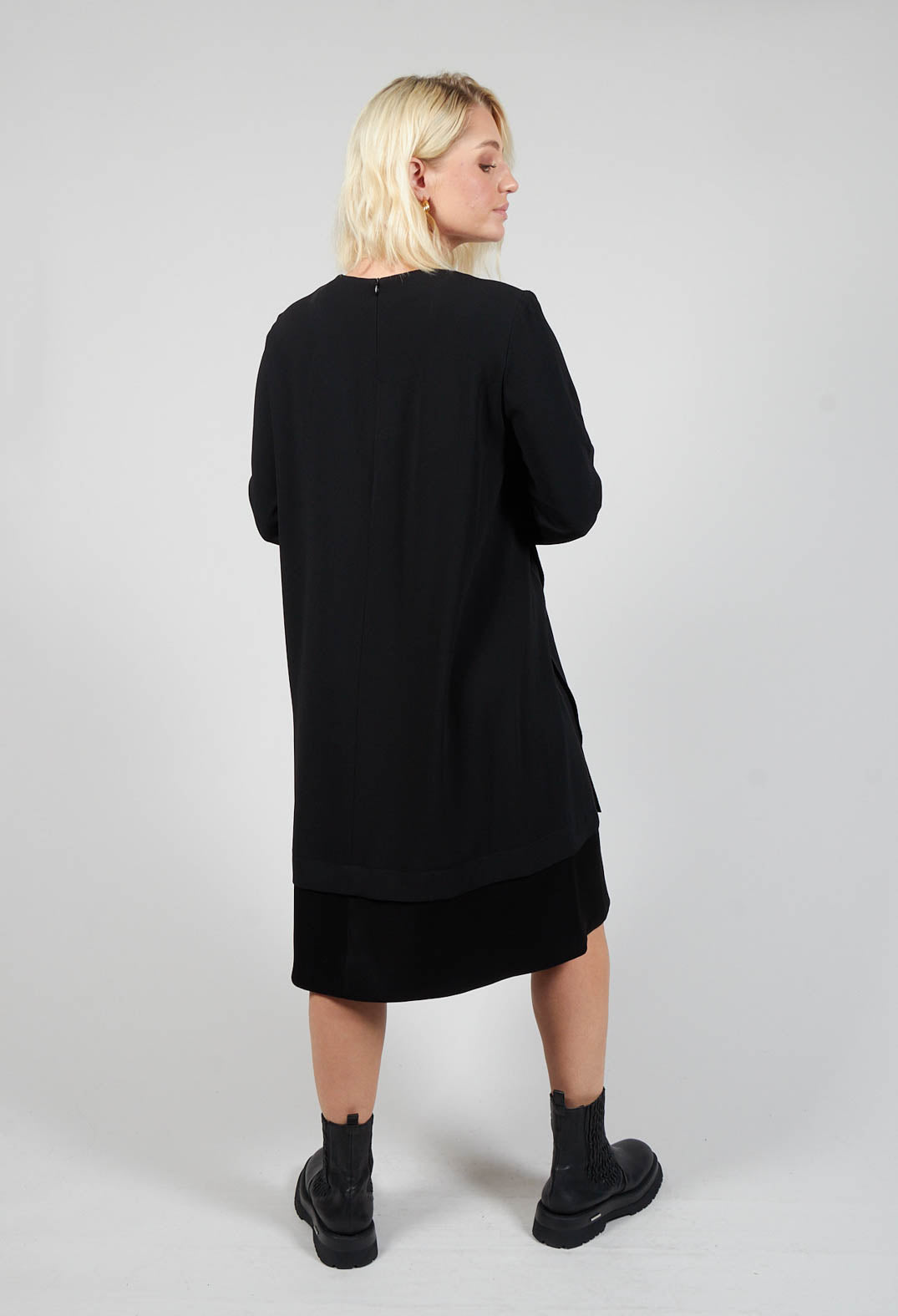 behind shot of ladies long sleeve black dress