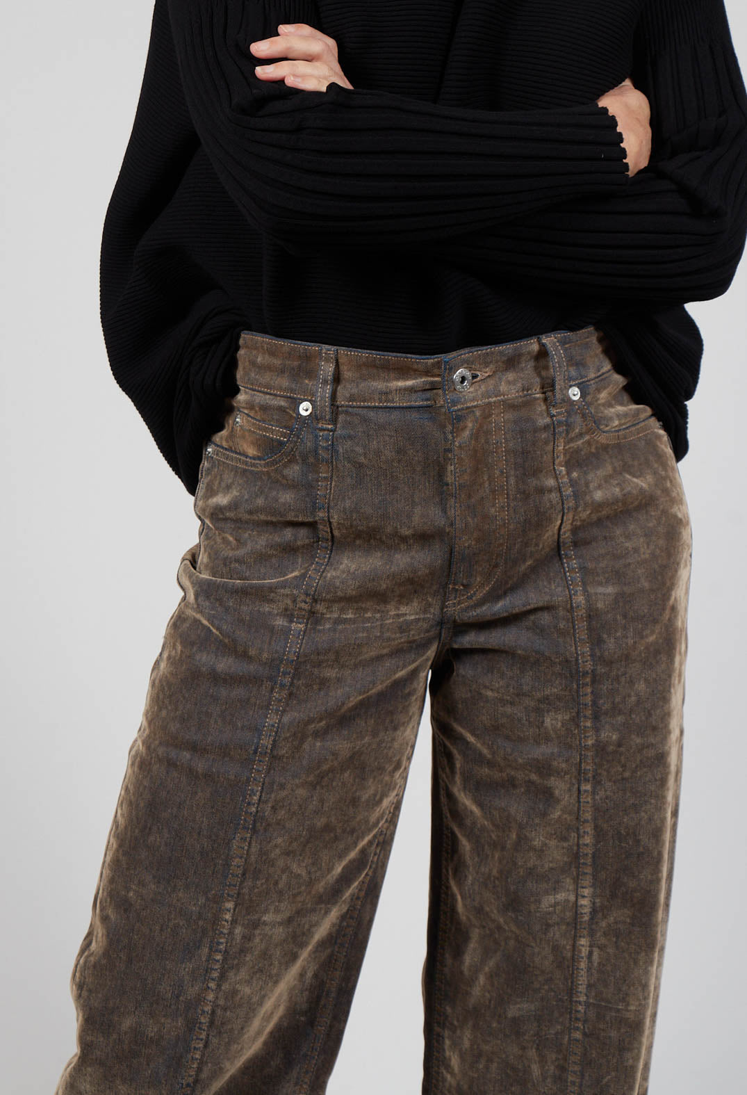 close up of ladies trousers in nutmeg shade, with button fastening and pockets