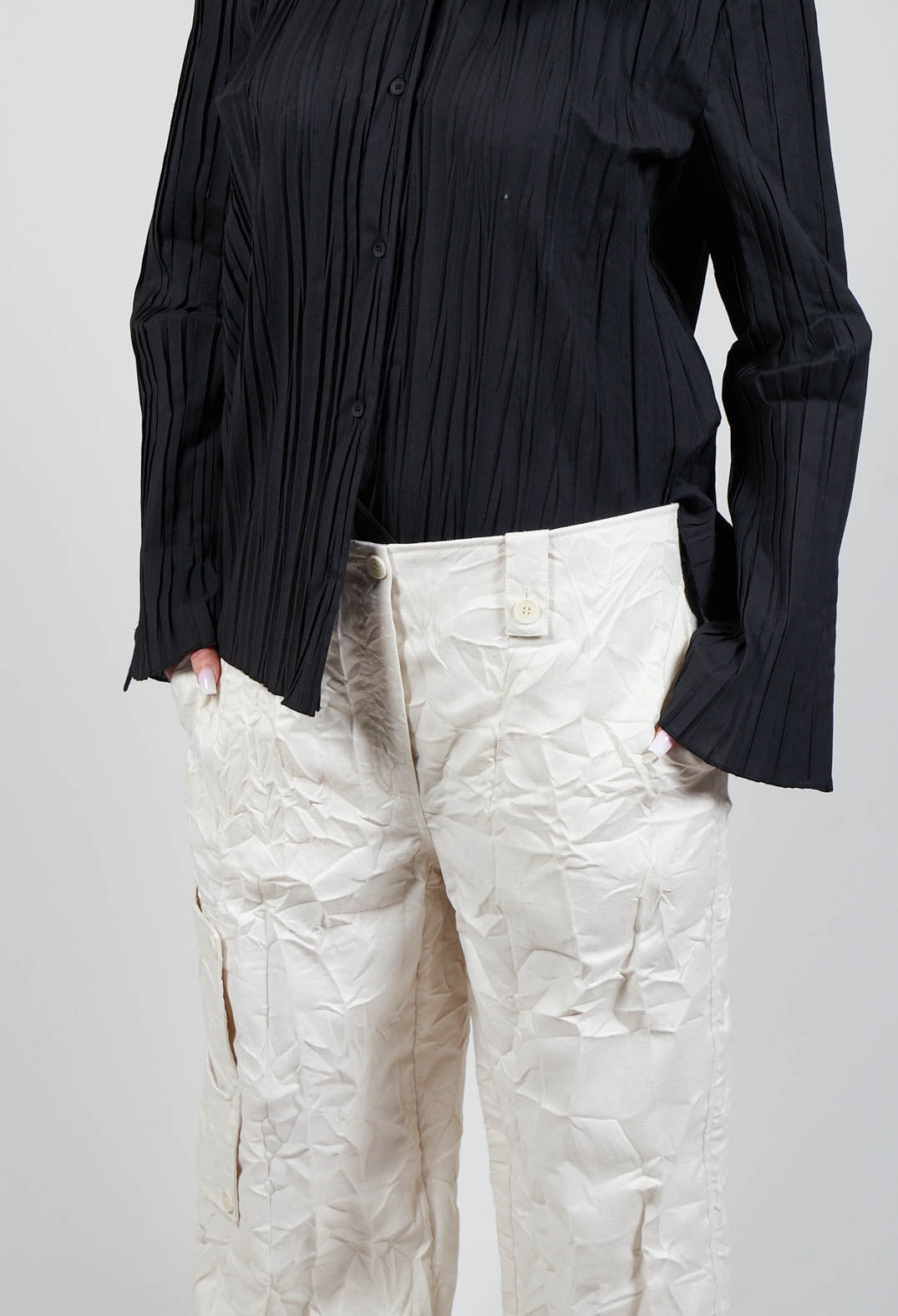 close up of ladies off white trousers in wide leg fit