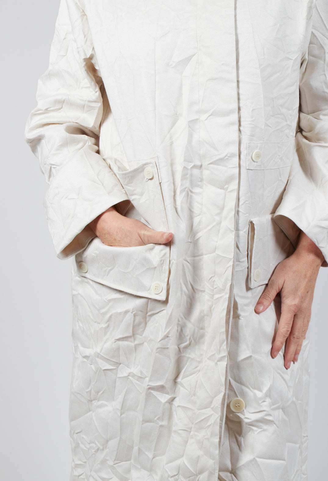 close up of ladies off white coat